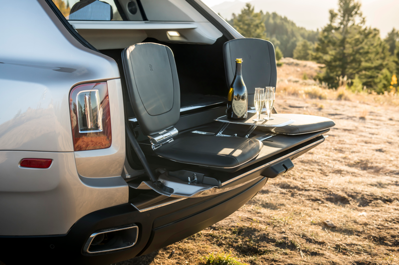 The “Cullinan Viewing Suite,” which pops out these leather seats and cocktail table from the back of the SUV with the press of a button.